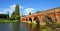 Great Barford Packhorse Bridge and Church Bedfordshire England.