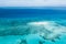 Great Barrier Reef and coral sand cay from above