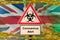 Great britain flag and Covid-19 biohazard symbol with quarantine orange tape. Coronavirus or 2019-nCov virus concept