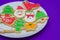 Great christmas background, christmas biscuits on white plate with blue background