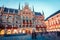 Great evening view of Marienplatz - City-center square & transport hub with towering St. Peter`s church, two town halls and a toy