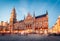 Great evening view of Marienplatz - City-center square & transport hub with towering St. Peter`s church, two town halls and a toy