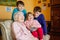 Great-grandmother with three children, siblings. Family of four, two boys and little toddler girl. Happy senior old