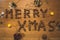 Great holiday inscription â€œMerry Xmasâ€ made from peanuts