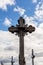 Great ornamental timber cross against cloudy sky