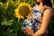 Great picture of a pregnant woman in a field of sunflowers