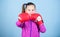 With great power comes great responsibility. Contrary to stereotype. Boxer child in boxing gloves. Female boxer. Sport