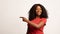 Great Promo. Cheerful African American Female Pointing Aside With Finger