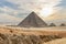 The Great Pyramid of Menkaure with dramatic sky in the Giza, Egypt