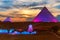 The Great Pyramids of Egypt and the Sphinx, enlighted at night, Giza