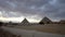 Great pyramids of Giza far away view at entrance with Sphinx