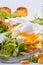 Great Salade Lyonnaise, French classic salad. Eggs, bacon, toasts.