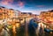 Great scene of famous Canal Grande. Colorful spring sunset from Rialto Bridge of Venice, Italy, Europe. Picturesque evening seasca