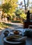 Great shot of a plate of crepe and a small plate with fruit slices in an open-spaced restaurant