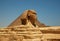 The Great Sphinx of Giza and the Great Pyramid in Cairo, Egypt with clear blue sky