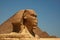 The Great Sphinx of Giza and the Great Pyramid in Cairo, Egypt with clear blue sky