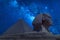 The Great Sphinx and Khafre Pyramid in Giza against night sky with stars and Milky way in Giza, Cairo, Egypt