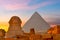 Great Sphynx of Giza and Pyramid of Cheops at sunset, Egypt