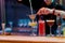 Great Taste. Close up of hands of male bartender pouring, mixing ingredients while making cocktails, alcoholic drinks at