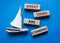 Great times are coming symbol. Concept words Great times are coming on wooden blocks. Beautiful blue background with boat.