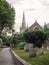 GREAT TORRINGTON, DEVON, ENGLAND, - AUGUST 3 2021: View of the Church of Saint Michael and All Angels, and churchyard.