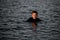 Great view of head of handsome young man in water