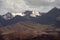 Great view of snow capped brown black mountain ranges