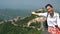 Great Wall of China tourist on travel presenting and showing famous destination