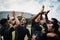 They are so great at winning. Cropped shot of a team of rugby players celebrating while standing on the field during the