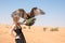 Greater spotted eagle during a desert falconry show in Dubai, UAE.