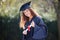 The greatest reward is the journey. Portrait of a young woman holding her diploma on graduation day.