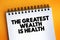 The Greatest Wealth Is Health text on notepad, concept background