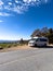 A Grech Strada Camper Van parked in an overlook in the Blue Ridge Mountains in North Carolina during the Autumn with leave in