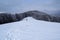 Grecul peak toward Leuca Mica peak. Winter landscape between Azuga and Grecului valley towards Gura Diham chalet