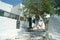 Greece, Amorgos, a shady cafe with tables and chairs.