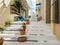 Greece Andros island Cyclades. Souvenir shop pots with plants on stone paved stairs at Chora town