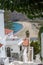 Greece. Andros island sandy beach Cyclades. Above view of houses coast sea at Chora town. Vertical