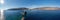 Greece.  Andros Island. The stone beacon on a rock aerial panorama. Chora town cape