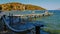 Greece beach foot bridge dock with boats
