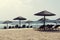 Greece beach with straw umbrellas and chairs