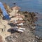 Greece, blue stairs to tranquil beach with umbrellas and chairs