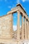 Greece. Colonnade of the Erechtheion temple in the ancient Athenian Acropolis against the blue sky