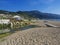 Greece, corfu, Agios Georgios, september 23, 2018: View on sea shore wooden promenade with sand beach, green river
