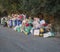 Greece, corfu, Agios Georgios, september 26, 2018: Piles of garbage on asphalt road, overfloating trash can, due to Municipality w