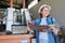 Greece, Crete, 09-09-2019. Woman with tourist advertisement in an olive factory