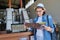 Greece, Crete, 09-09-2019. Woman with tourist advertisement in an olive factory