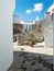 Greece Cyclades, Tinos island Volax village. Old stonewalls between whitewashed buildings. Vertical