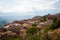 Greece, Delphi, August 2016, beautiful sun shining through the clouds lightning just part of hill. Panorama from one of city resta