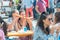 Greece, Heraklion - September 15: Two girls eating street food outdoors. Street food festival