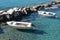 Greece the island of Sikinos. Two boats moored in the still waters of the harbour.